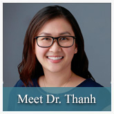 The image features a person with glasses smiling at the camera, wearing a blue shirt and a black lanyard. They are positioned against a neutral background with their name  Dr. Thanh  visible below them.