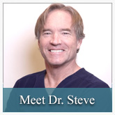 The image shows a man posing for a portrait with a friendly expression. He has short hair, is wearing glasses, and is dressed in a casual shirt. Behind him, there s a plain background with text that reads Meet Dr. Steve.